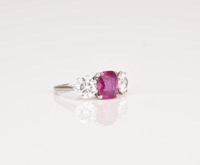 Lot 161 - A three stone ruby and diamond ring