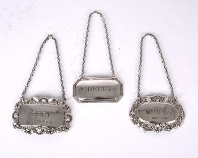 Lot 22 - Three silver decanter labels