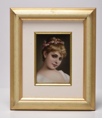 Lot 219 - A German porcelain rectangular portrait plaque of a young girl with pink ribbon