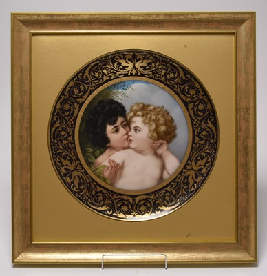 Lot 245 - A framed Vienna circular charger of 'Sibling Love', 19th century