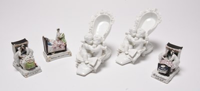Lot 248 - A pair of Meissen shoes with cherubs and three fairings