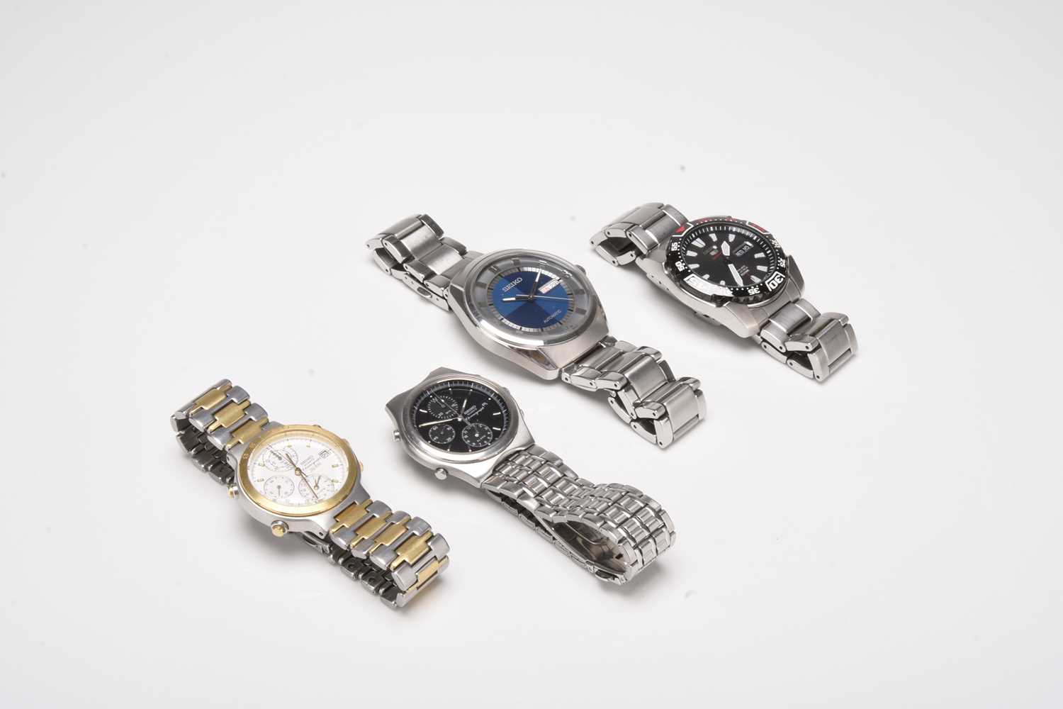 Lot 458 - A group of four Seiko gentleman's stainless steel bracelet watches