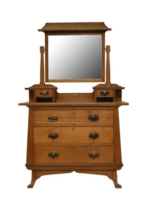 Lot 135 - An Arts & Crafts oak dressing chest by Fosters of Nottingham