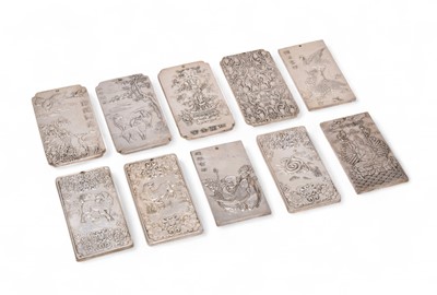 Lot 56 - A group of ten Tibetan silver amulet pendant plaques