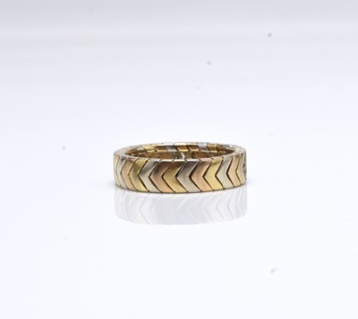 Lot 404 - A Cartier 18ct tri-coloured gold diamond set band of chevron design