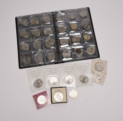 Lot 250 - An album containing approximately 115 coins
