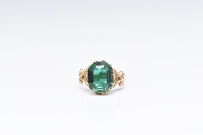 Lot 247 - A 9ct gold green paste set ring