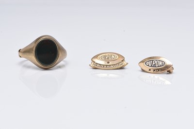 Lot 133 - A 9ct gold signet ring and two Dupont badges