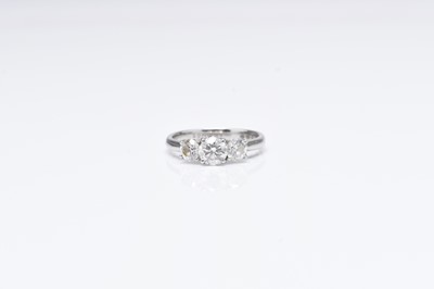 Lot 298 - A platinum three stone diamond ring