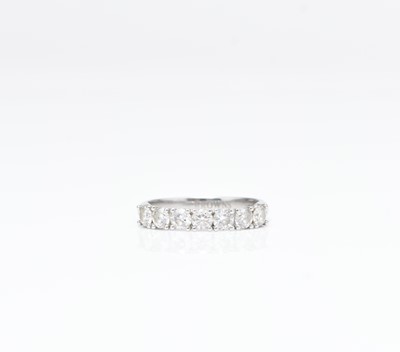 Lot 216 - A platinum seven stone brilliant cut diamond half eternity ring
