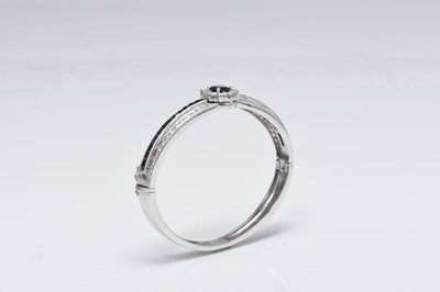 Lot 307 - A sapphire and diamond bangle and ring