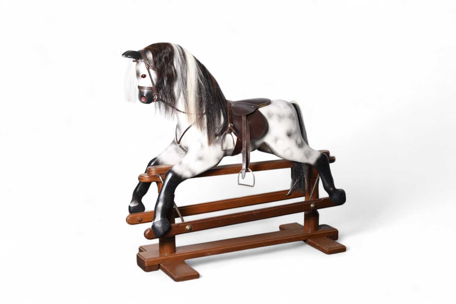 Lot 189 - A late 20th century dapple grey painted wood rocking horse