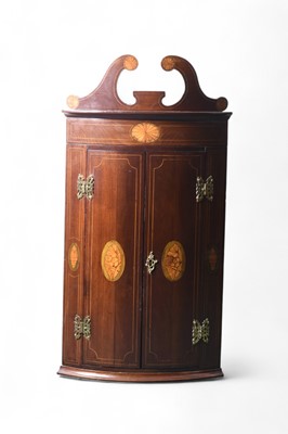 Lot 51 - A small George III inlaid corner hanging cabinet