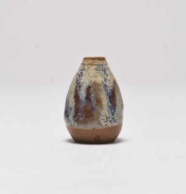 Lot 84 - A miniature studio pottery vase with mottled glaze