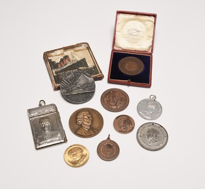 Lot 232 - An assorted collection of nine late 19th century and early 20th century base metal medals