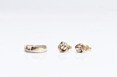 Lot 254 - An 18ct gold diamond set ring and a pair of 9ct gold earrings