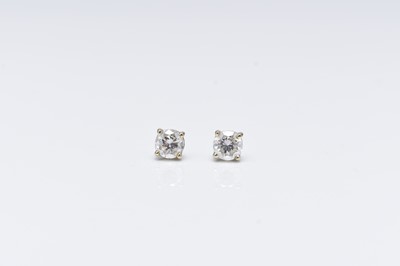 Lot 212 - A pair of 18ct white gold brilliant cut diamond earrings