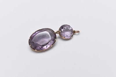 Lot 204 - An amethyst drop pendant