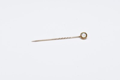 Lot 106 - An early 20th century opal stick pin