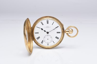 Lot 333 - M.F. Dent: An 18ct gold half hunter pocket watch