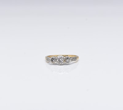 Lot 222 - A graduated three stone diamond ring