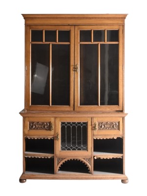 Lot 102 - A late Victorian/Edwardian oak glazed bookcase cabinet
