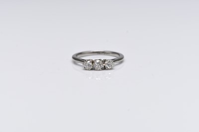 Lot 268 - A three stone graduated old cut diamond ring