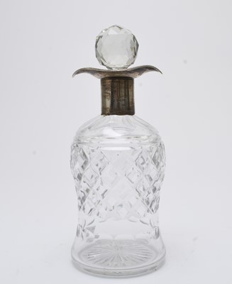 Lot 99 - A silver mounted double spouted glass decanter