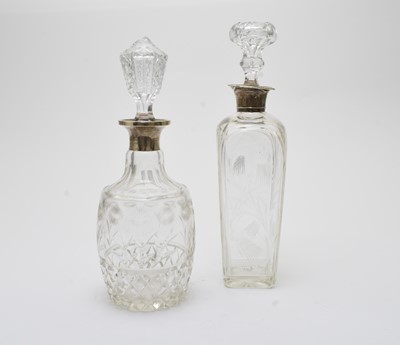 Lot 32 - Two silver mounted glass decanters