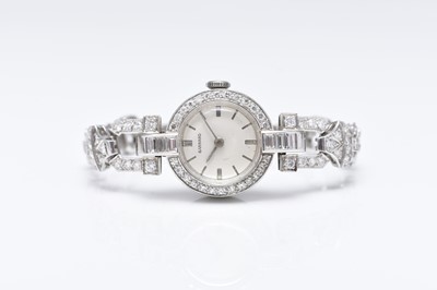 Lot 330 - Garrard: A lady's diamond set white metal bracelet watch