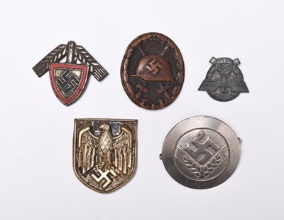 Lot 293 - Germany, Third Reich - Black wound badge, two RAD badges, Afrika Korps helmet badge, tinnie