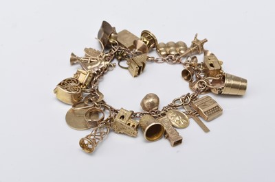 Lot 145 - A 9ct gold bracelet with attached charms
