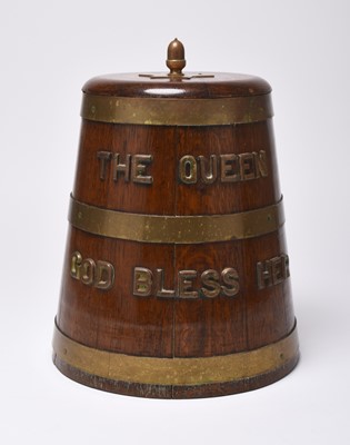 Lot 243 - A Pusser's reproduction oak ice bucket in the form of a Royal Navy rum mixing barrel