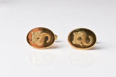 Lot 132 - A pair of yellow metal cufflinks