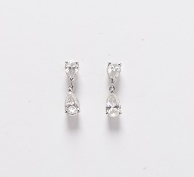 Lot 229 - A pair of 18ct white gold pear cut diamond ear pendants