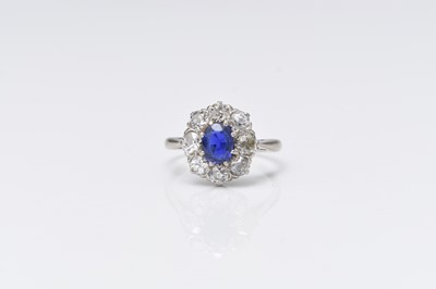 Lot An early-mid 20th century old cut diamond and sapphire oval cluster ring