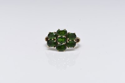 Lot 120 - A 9ct gold seven stone green diopside ring