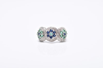 Lot 252 - A 9ct white gold emerald, sapphire and diamond cluster ring