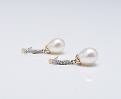 Lot 264 - A pair of 14ct gold diamond and cultured pearl earrings