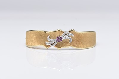 Lot 137 - A ruby and diamond bangle