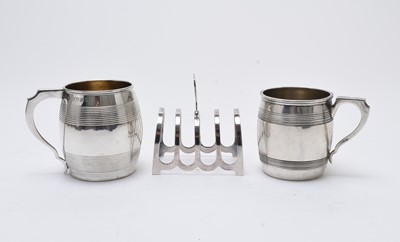 Lot 53 - Two silver mugs and a silver toast rack