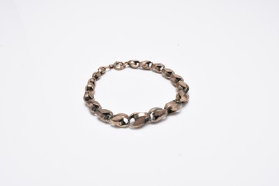 Lot 147 - A yellow metal graduated link bracelet
