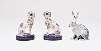 Lot 153 - Royal Crown Derby 'Starlight Hare' and a pair of Staffordshire spaniels