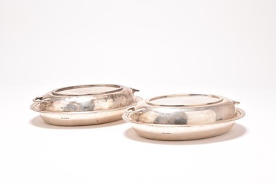Lot 187 - A near pair of silver entree dishes and covers