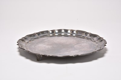 Lot 123 - A white metal salver