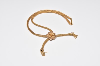 Lot 393 - A yellow metal tassel necklace