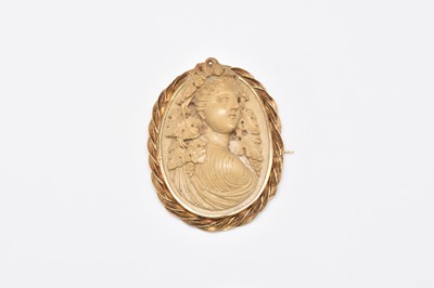 Lot 329 - A 19th century lava cameo brooch depiciting Baccus