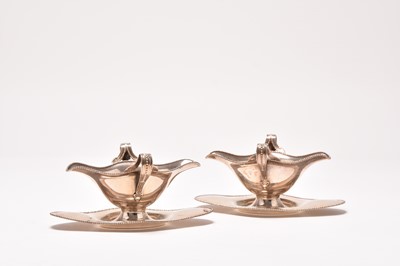 Lot 182 - A pair of Edwardian silver sauce boats on stands