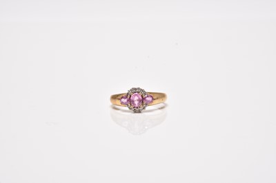 Lot 22 - A 9ct gold pink sapphire and diamond ring