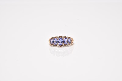 Lot 70 - A 9ct gold tanzanite and diamond ring